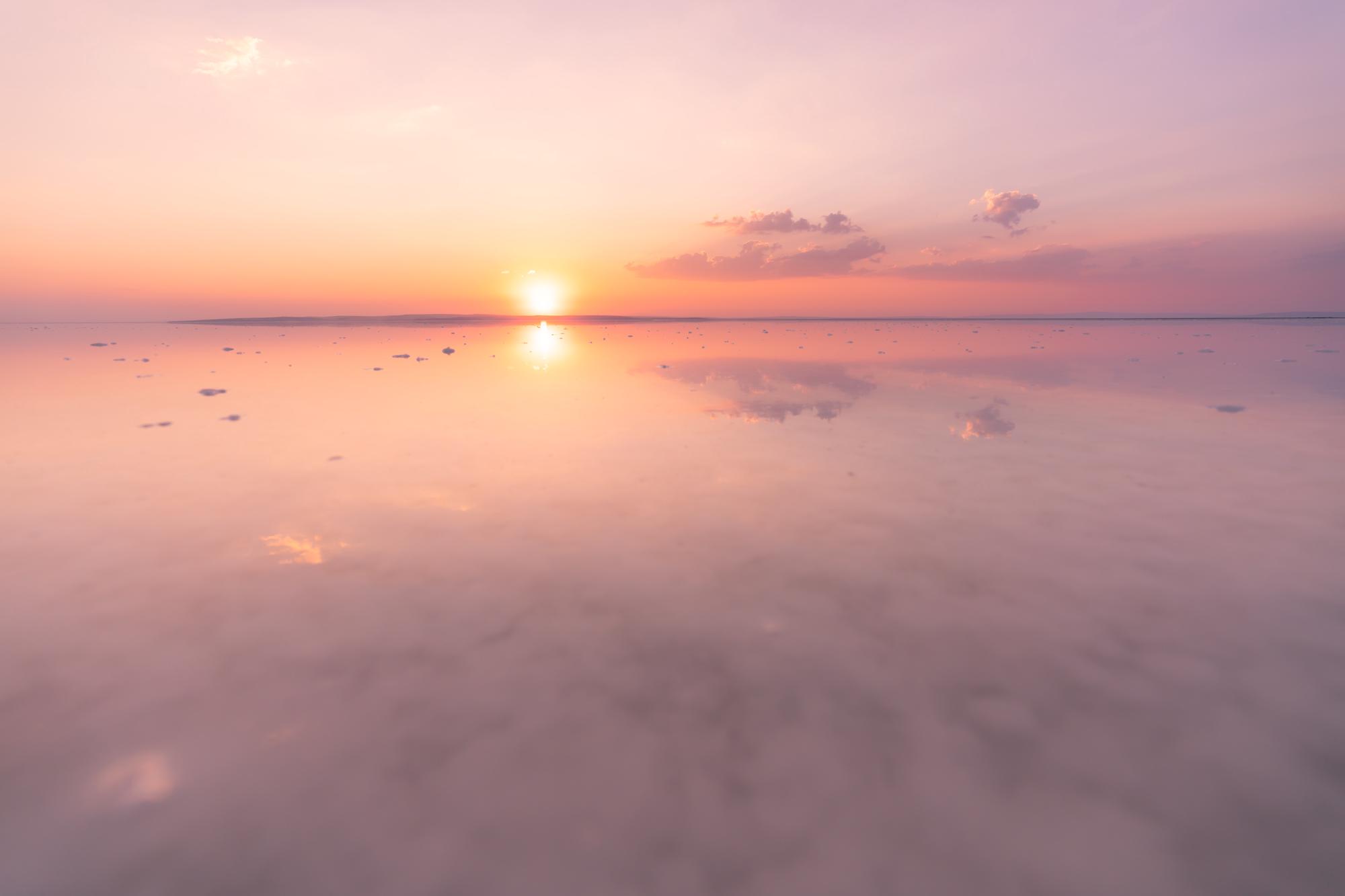 A Ginormous salt lake reflecting like a mirror in Turkey at sunset