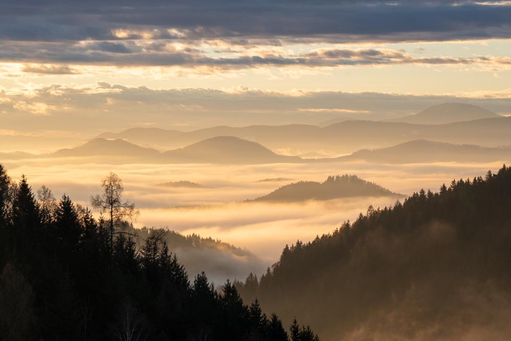 Warm foggy sunrise in the Saualpe, Austria