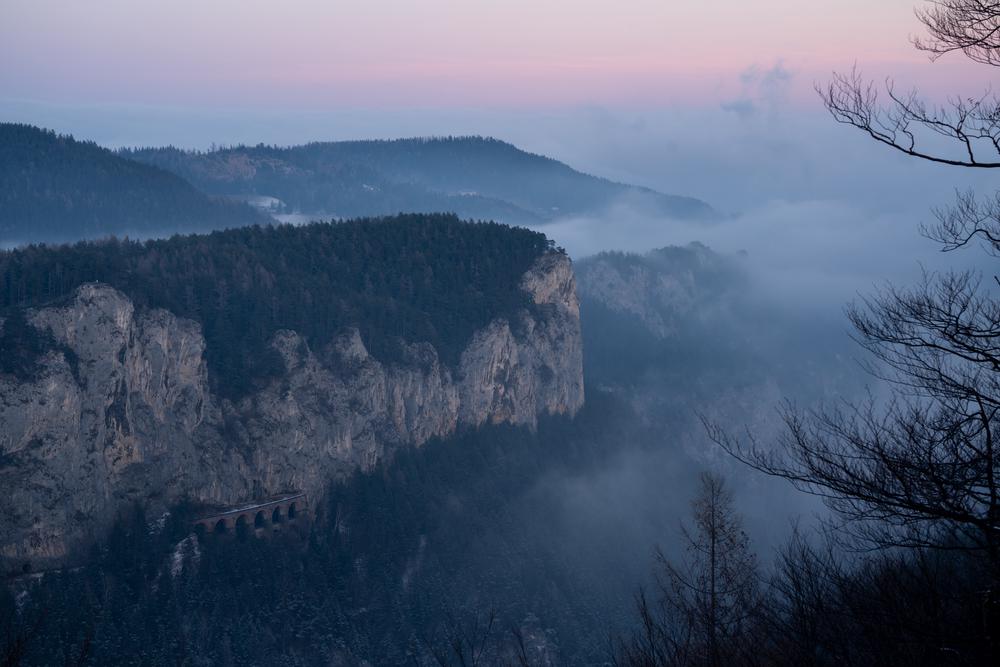 Winter sunset in Semmering as the fog rolls in, Austria